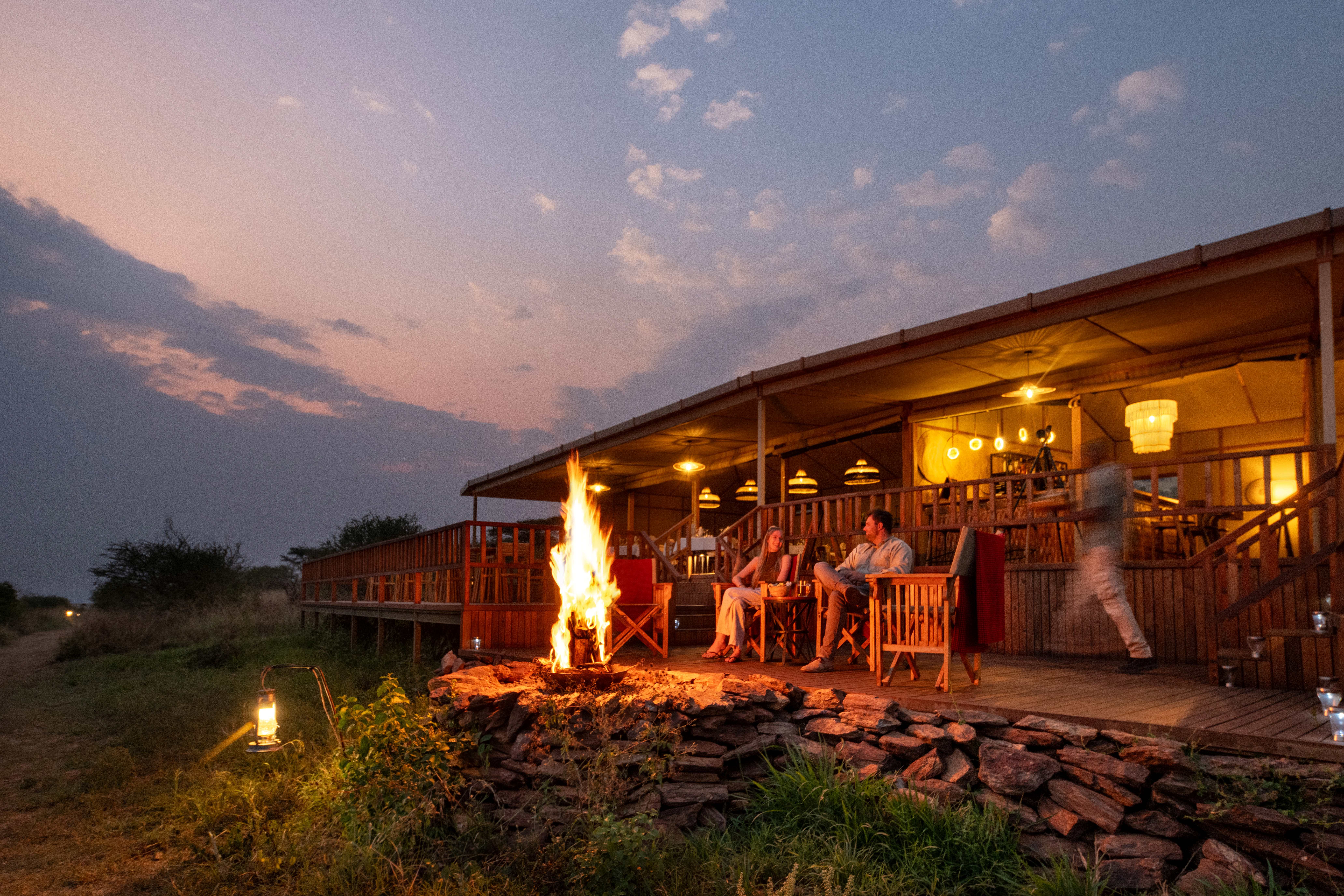 Sundowners round the firepit at Nyikani Camp Central Serengeti