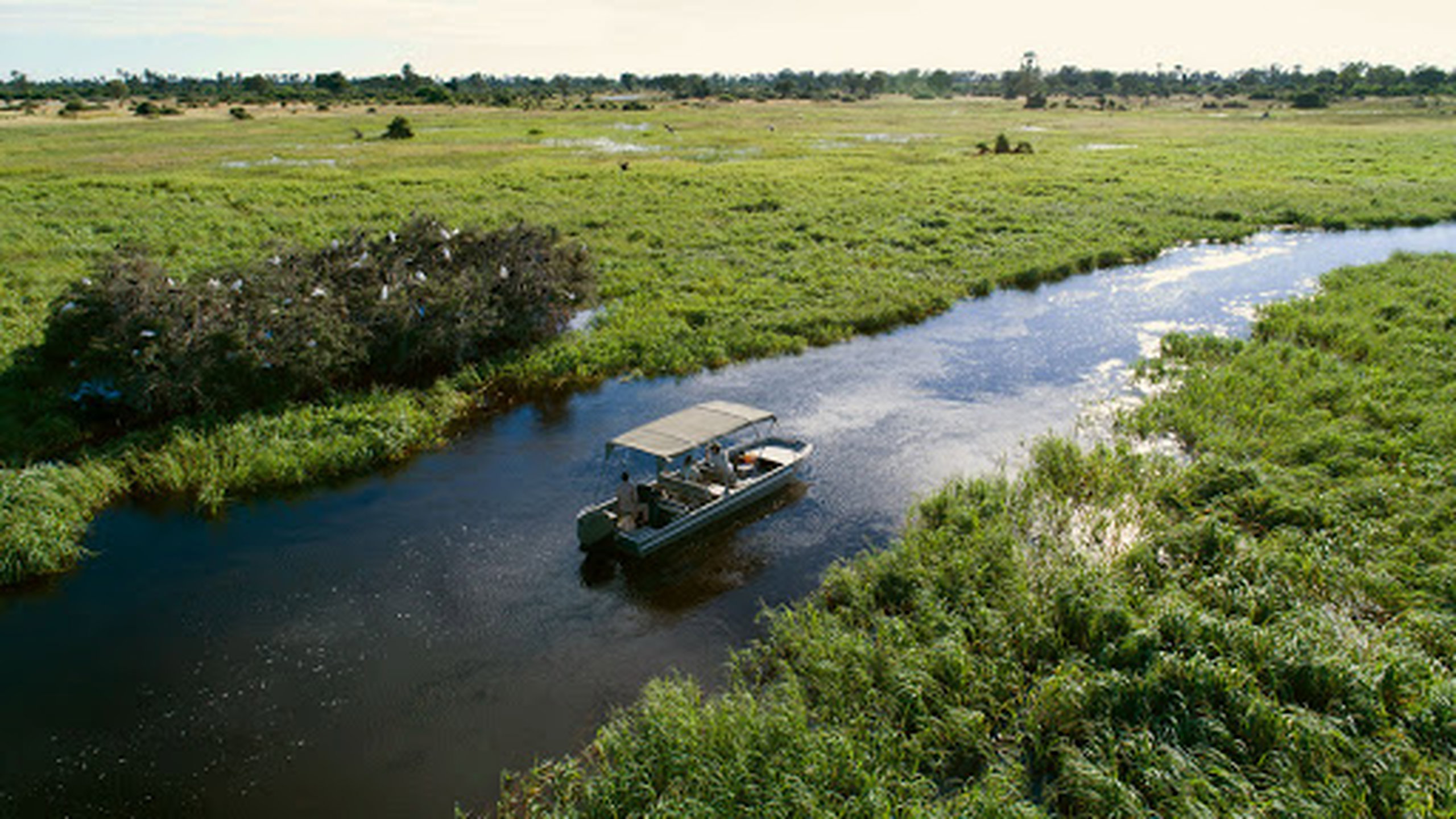 boat safari at gomoti plains